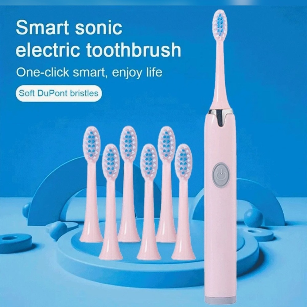 Electric toothbrush with replacement heads. New.